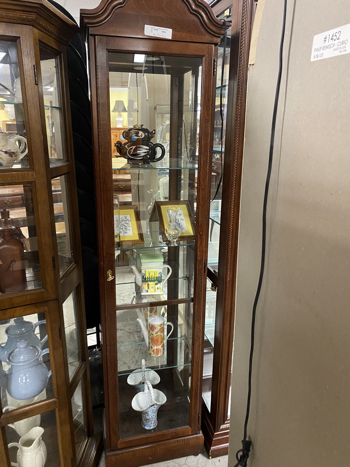 Beautiful curio cabinet by Howard Miller $199