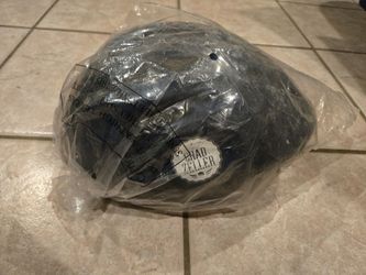 Large child bicycle helmet, says Chad Zeller on it.