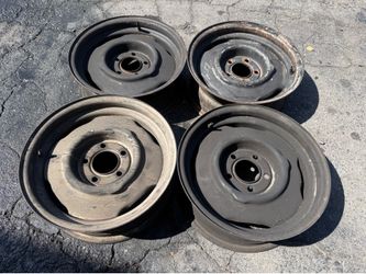 Four 15x5.5 inch Original Mopar Stock Steel Wheels 5x4.5 inch