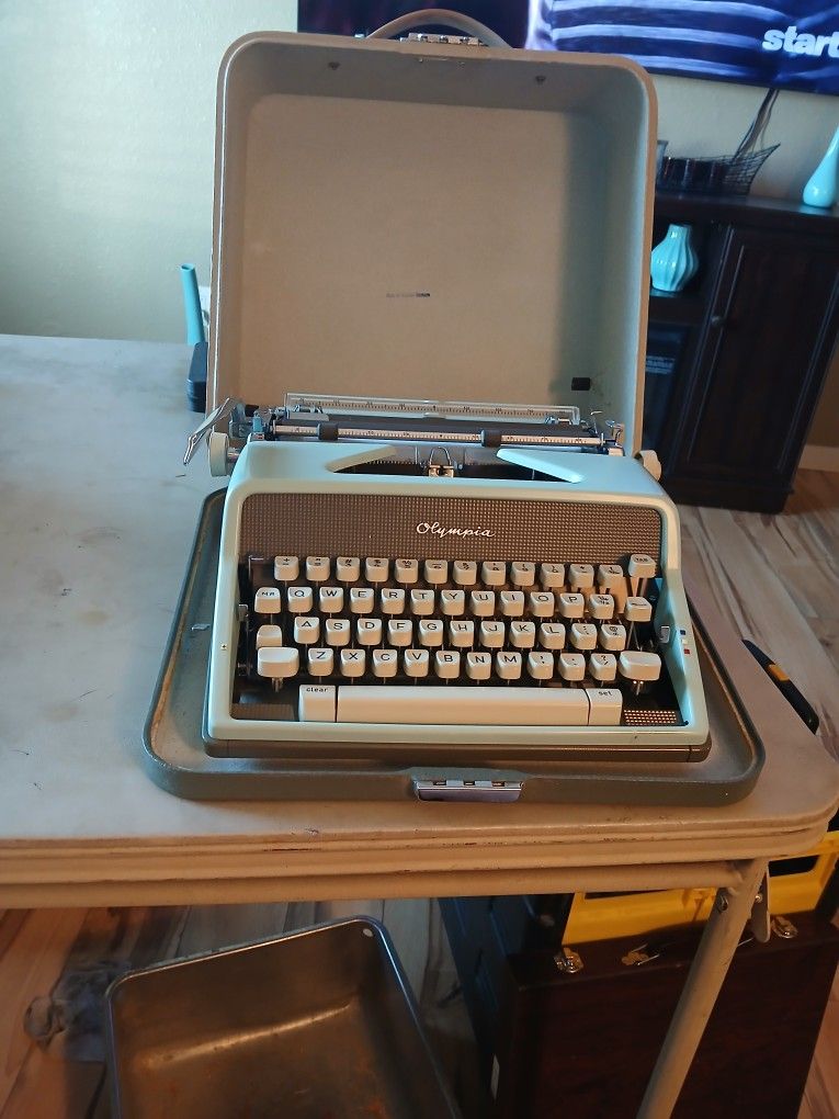 Vintage Olympia Blue Deluxe Typewriter