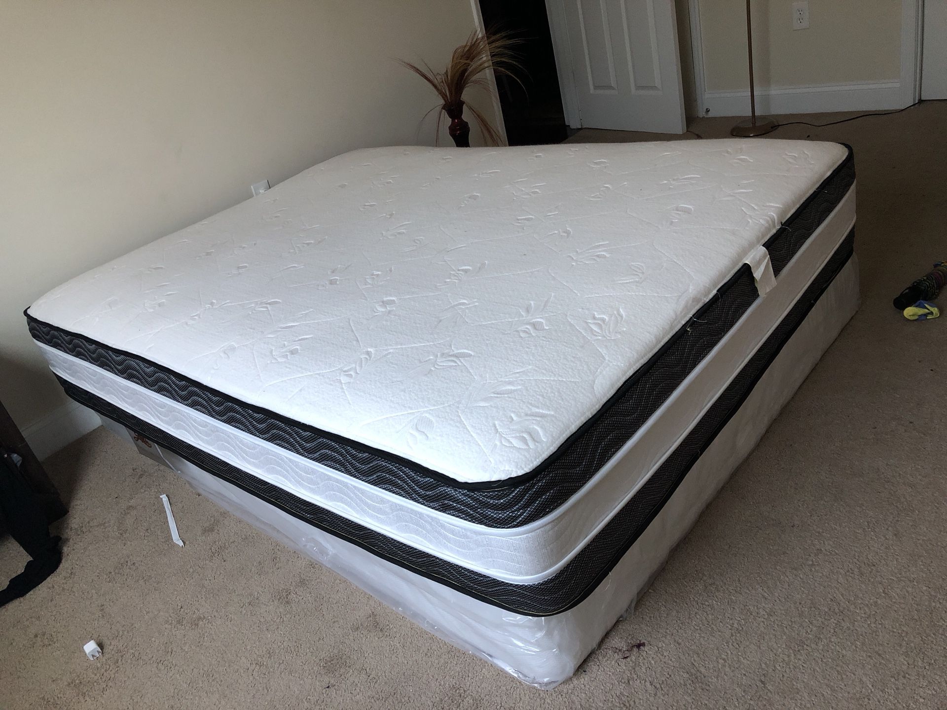 Pillow top on both sides and the box spring still got the plastic on it
