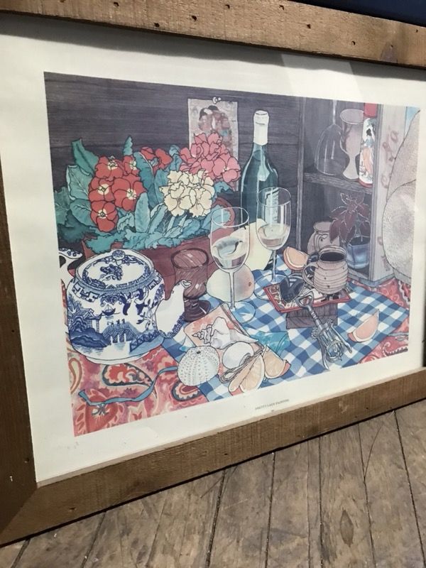 Brown framed dinning table painting