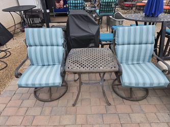 $120  PATIO SET 2 SWIVEL CHAIRS AND TABLE