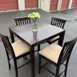 Wooden high table and four chairs