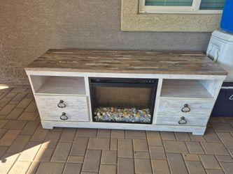 ASHLEY TV STAND WITH ELECTRIC FIREPLACE, IN VERY GOOD CONDITION, WORKS PERFECTLY