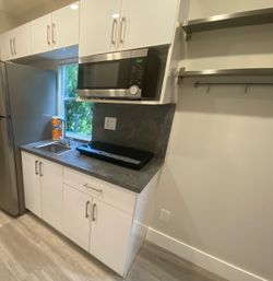 Small kitchen cabinet, counter, sink, and faucet