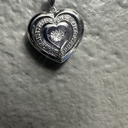 1/20 CT. T.W. Diamond Triple Heart Locket in Sterling Silver