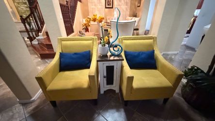 Beautiful Carocc accent chairs witnailheads and solid wood yellow lines