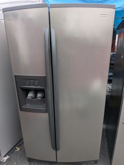 Kenmore side by side refrigerator/3 months of warranty and free local delivery