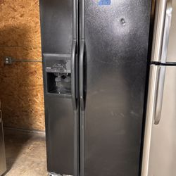 Refrigerator side by stove