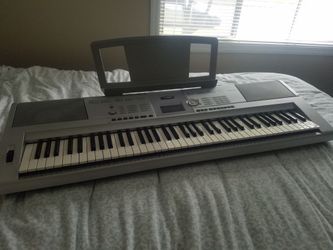 YAMAHA portable grand DGX-205 keyboard.