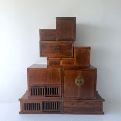 Vintage seven-piece modular, solid wood tansu chest with brass details