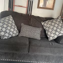 Gray fabric couches in good condition.