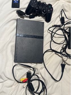 playstation 2 with controller and memory card