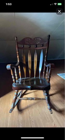 A mid-century stenciled pine tavern-style rocking chair.