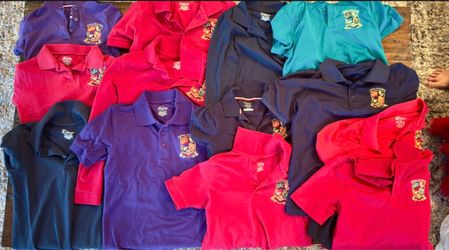Doral Academy School Uniforms Great condition Short and long sleeve  2  Long Sleeve Shirts one Red one Navy  1 skirt size 6 Size 7/8,