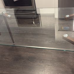 Modern glass rectangular dining table with metal legs in brown walnut finish