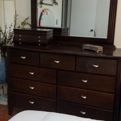 Solid Dark Wood Bedroom Set, includes 9 Drawer Dresser, Framed Mirror, and Night Stand.