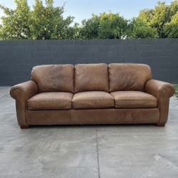 Free tan rolled arm sofa