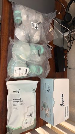 Motif Aura breast pump like new with new sealed parts