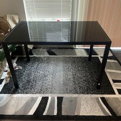 Black Table And Area Rug 