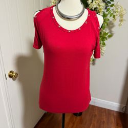 Reddish women’s shirt with decorative silver tone studs off the shoulder