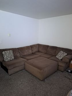 3 piece sectional sofa with ottoman and pillows