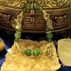 Jade charm bracelet with silver colored accents. Size medium