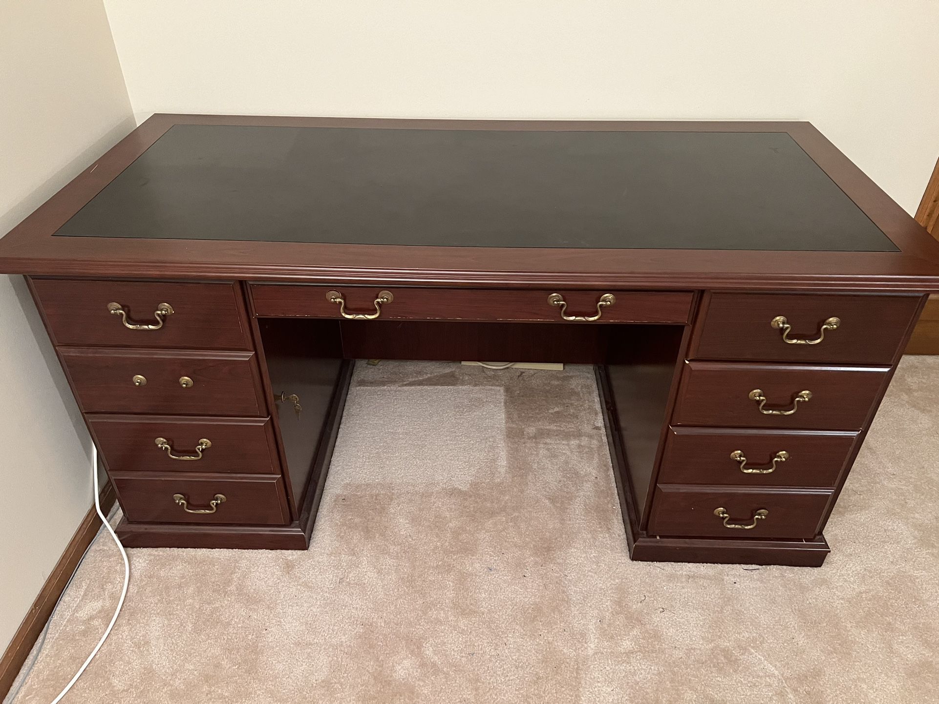 solid wood desk with brass pulls