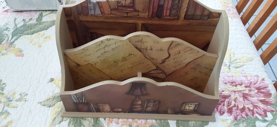 Desk letter holder. It's peeling but is okey condition