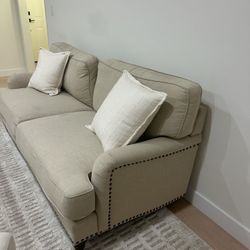 Beige Linen Couch With Accent Pillows