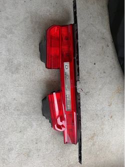 OEM tail light assembly. 14 dodge challenger