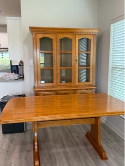 Table with 6 chairs and china cabinet