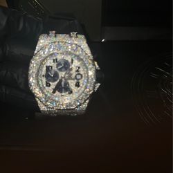 Ap. Iced out face and bezel with plane black strap