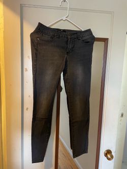 Lady's faded charcoal grey tight jeans - stretch and fit-enhancing style Dark grey washed tight jeans with geometric pattern logo Mid-rise faded black