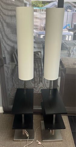 Pair night stands or side tables with lamps