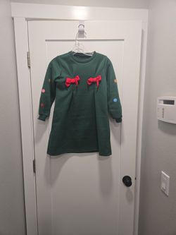 Green Dress with Red Bows and Colorful Dots
