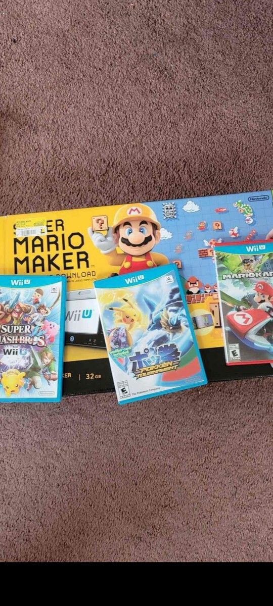 Wii U in box with games