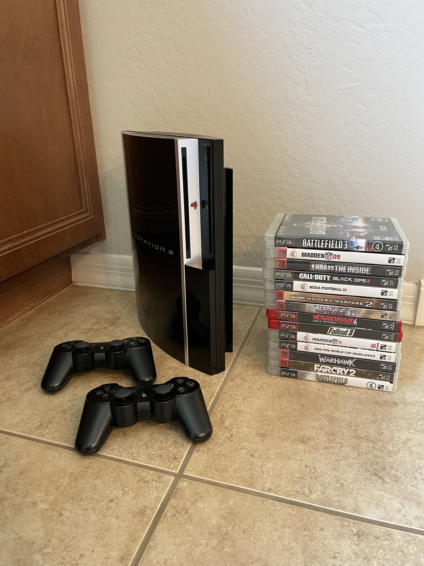 PS3 with 2 Controllers and 14 Games