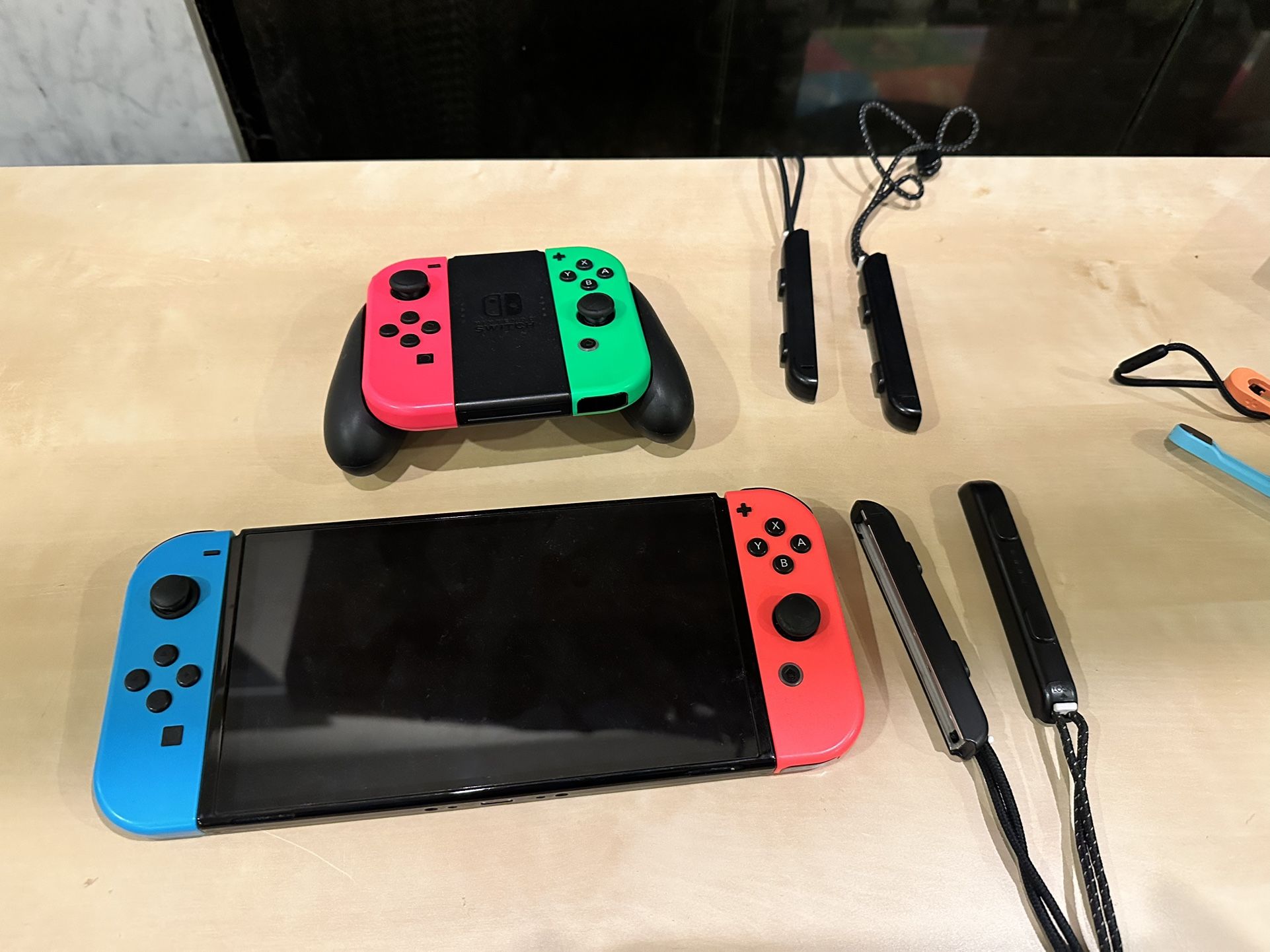 nintendo switch oled screen and controllers