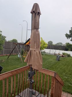 Deck umbrella with base