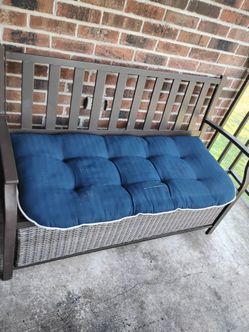 Brown bench with pillow
