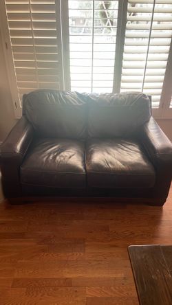 Leather two seater couch in good condition