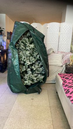 5 Feet Christmas Tree With Stand comes with rolling Tree Bag . back with side handles