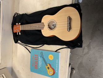 Ukulele with pick and how to book
