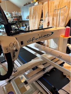 Handi Quilter HQ Fusion 24” longarm quilting machine on a 12-foot frame