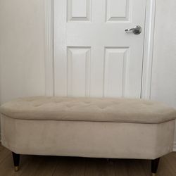 Beige tufted storage bench / ottoman