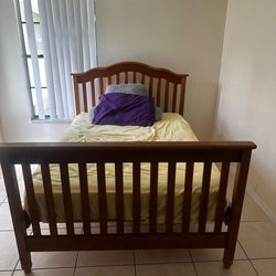 Queen size wooden bed frame and mattress, some wear