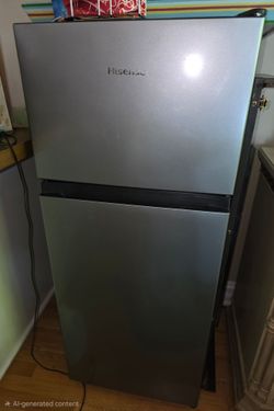 Hisense Minifridge with top freezer,  like new. Highland Park