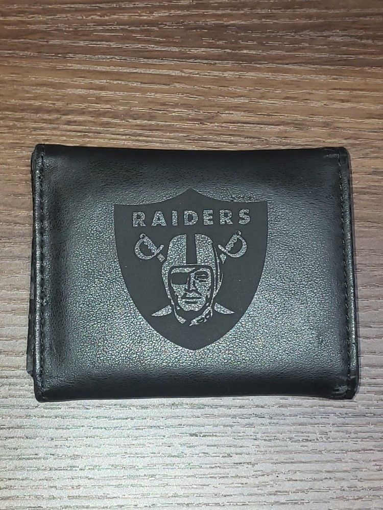 BLACK RAIDERS WALLET, USED IN WEAR N TEAR CONDITION.